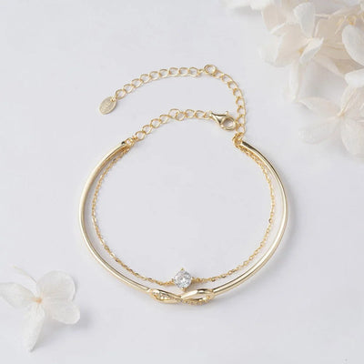 Elegant 925 Sterling Silver Infinity Bracelet with Zirconia Gold and delicate chain design.