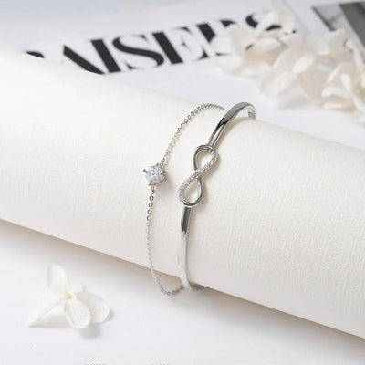 925 sterling silver infinity bracelet with zirconia charm on a white background, symbolizing elegance and eternity.