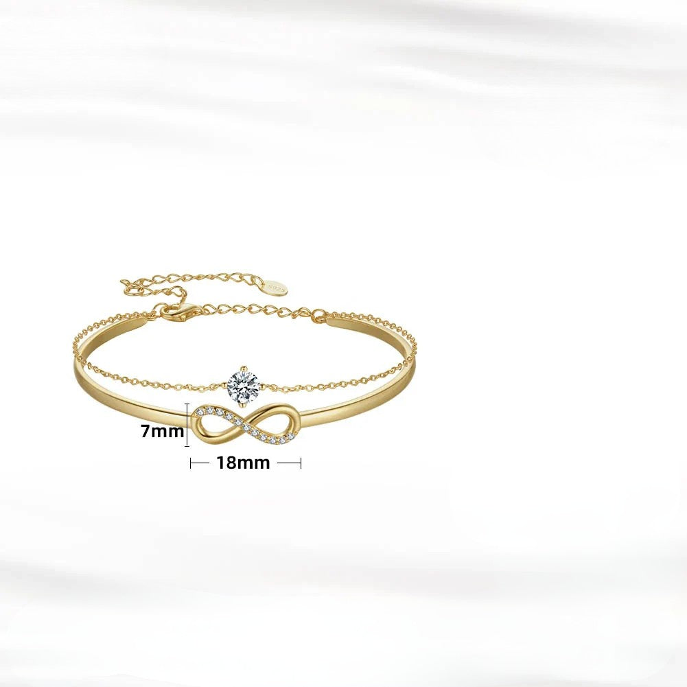 925 sterling silver infinity bracelet with zirconia gold, elegant design, showcasing infinity symbol and glimmering stones.