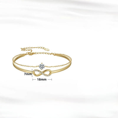925 sterling silver infinity bracelet with zirconia gold, elegant design, showcasing infinity symbol and glimmering stones.